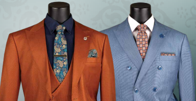 Two suits on mannequins with ties against a light gray background